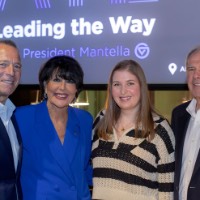 GVSU President poses with 3 Leading the Way to Atlanta attendees